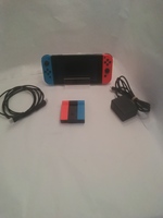 Red and Blue Nintendo Switch with HDMI, Power Cable, and Dock