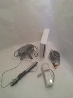 White Nintendo Wii with Controller, Sensor Bar, AV Cables, and Power Cable